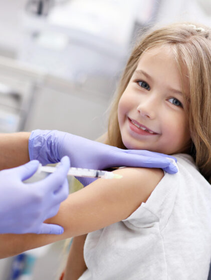 little girl getting her flu shot