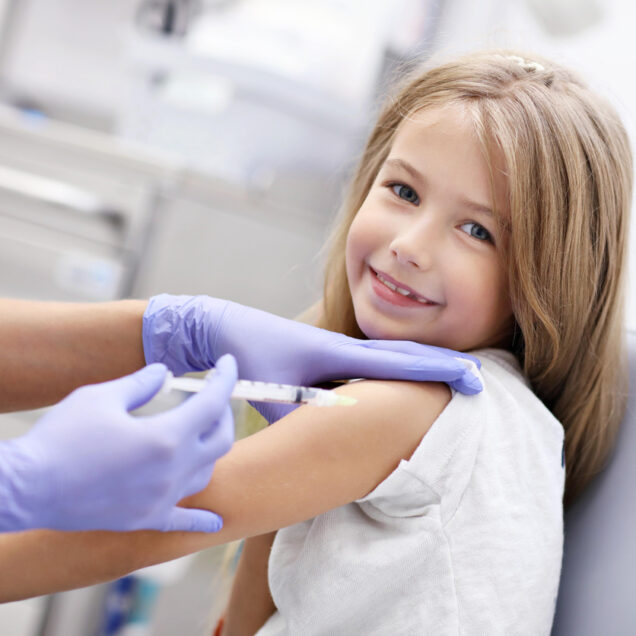 little girl getting her flu shot
