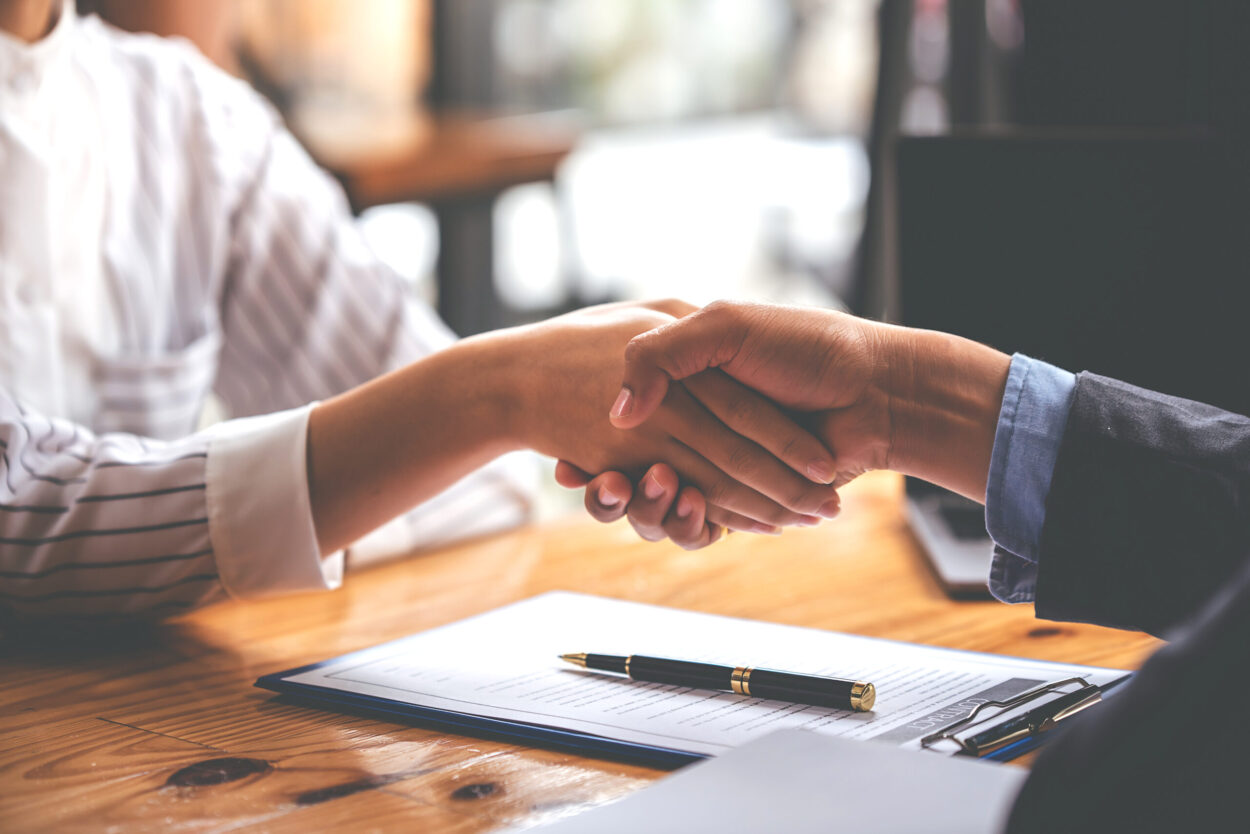 Legal document and handshake