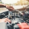 auto mechanic working on a transmission