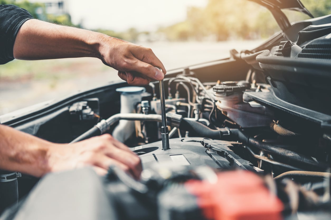 auto mechanic working on a transmission