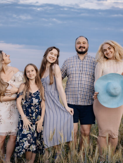 A full family at sunset. Photo for a family album. Photo of a family in the village