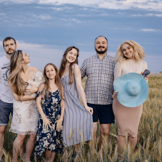 A full family at sunset. Photo for a family album. Photo of a family in the village