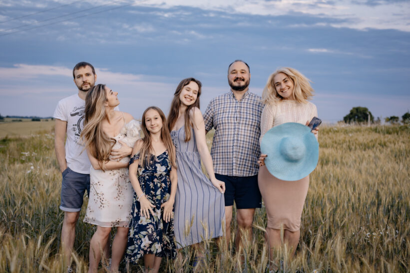 A full family at sunset. Photo for a family album. Photo of a family in the village
