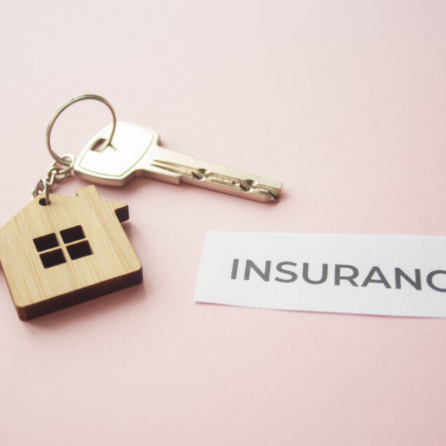 Wooden house toy and silver key on bright pink background with phrase quote Insurance. Mortgage, house buy sell, investment, rent, Real Estate Agent concept