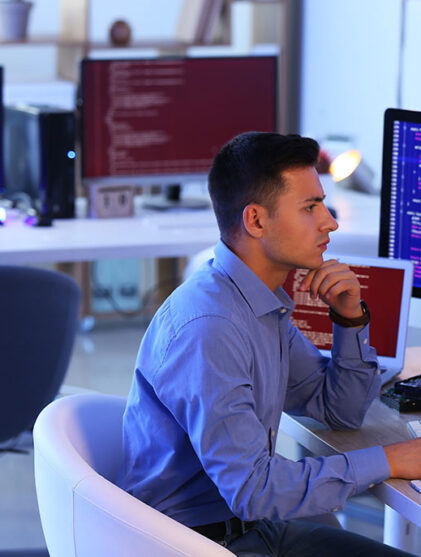 Programmer working in office at night