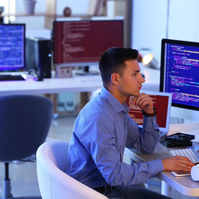Programmer working in office at night