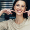 Women showing off her cosmetic dentistry