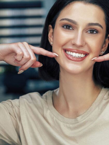 Women showing off her cosmetic dentistry