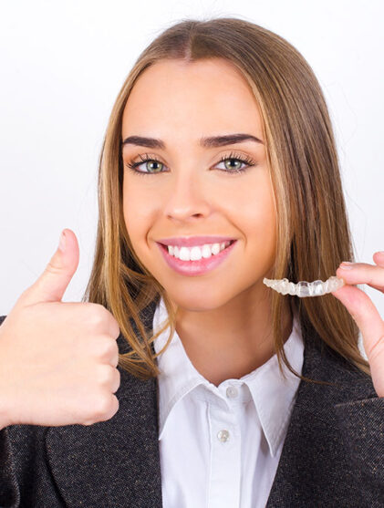 Young business woman wearing jacket over white background holdin