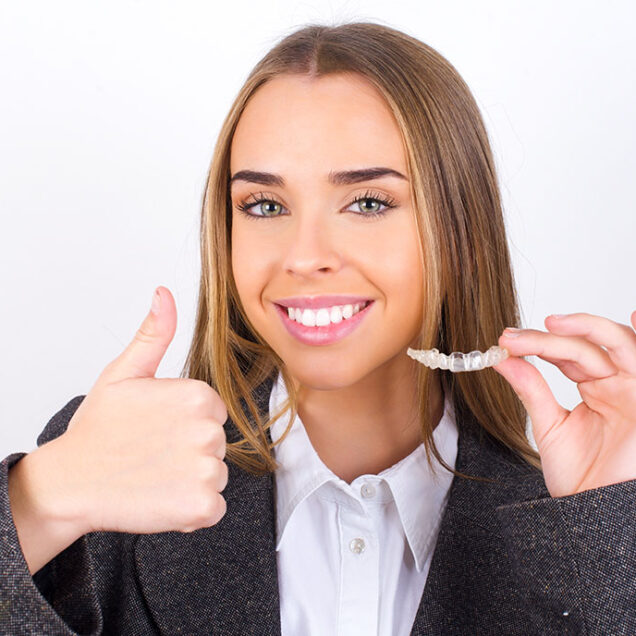 Young business woman wearing jacket over white background holdin