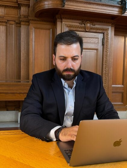 man sitting at laptop