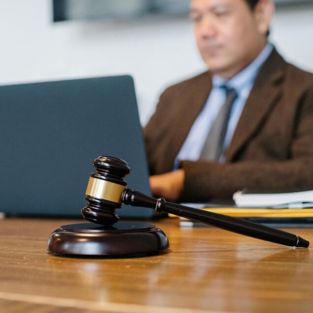 judge working on laptop in office