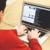 Programmer using laptop