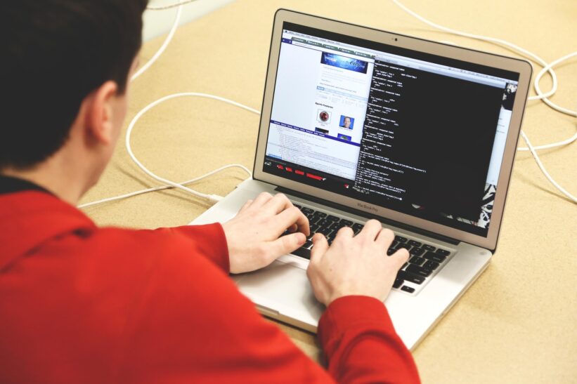 Programmer using laptop