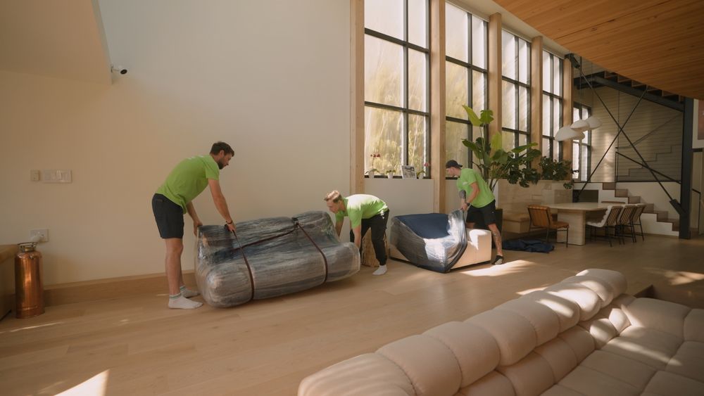 men working to move items in an apartment