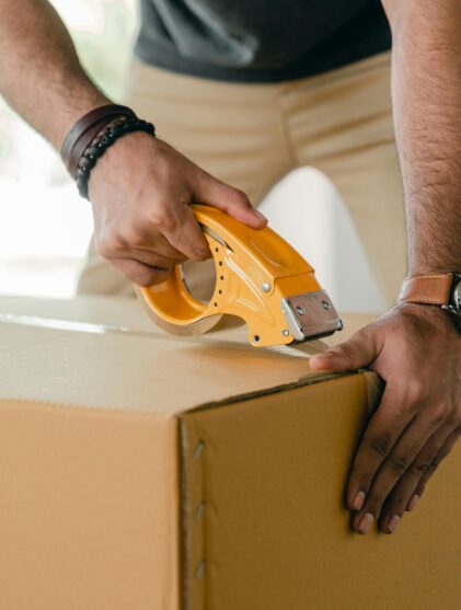 taping a cardboard box