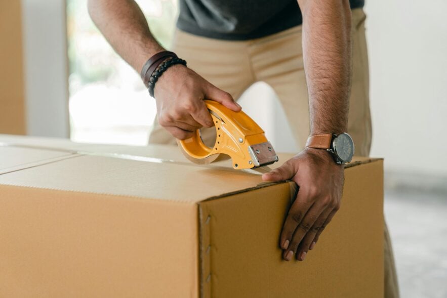 taping a cardboard box