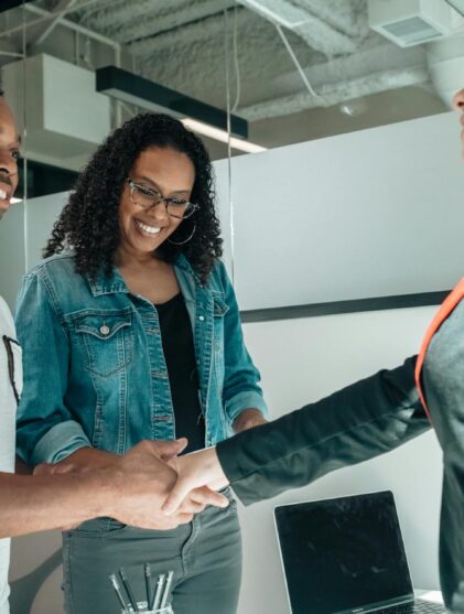 lawyer shaking the hands of clients