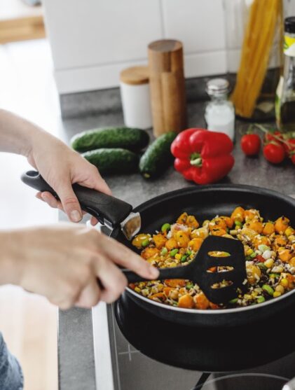 woman cooking in a pan