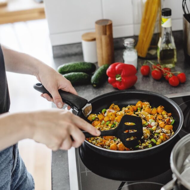 woman cooking in a pan