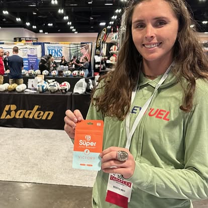 woman holding an orange and white packet