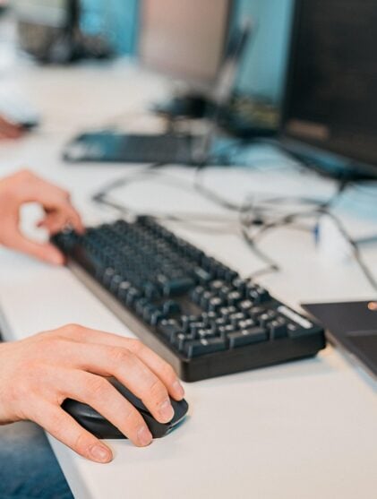 man using keyboard and mouse