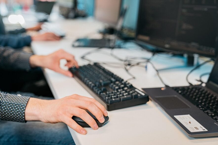 man using keyboard and mouse
