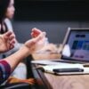 person gesturing during a meeting