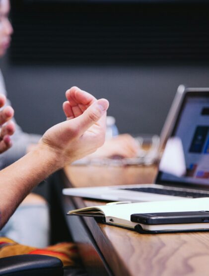 person gesturing during a meeting