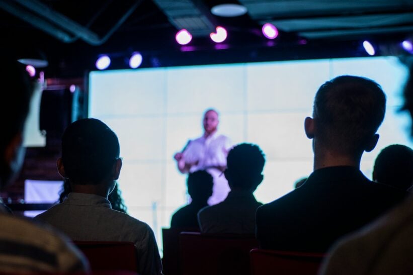 audience listening to a speaker