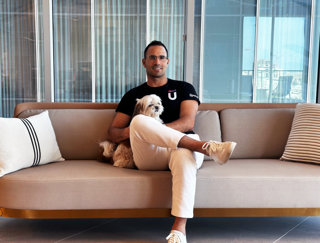 man sitting with his legs crossed